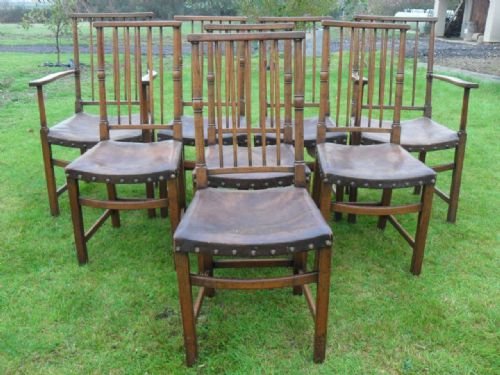 Set of 8 19th Century Oak Stick Back Leather Seat Dining Chairs