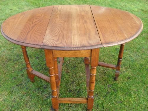 Golden Oak Turned Leg Oval Gateleg Drop Leaf Dining Table