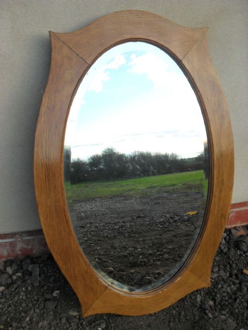 Shaped Oak Frame Oval Bevel Edge Mirror