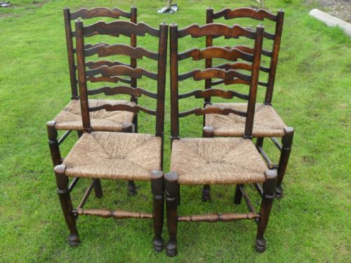 Set of Four Oak and Elm 19th Century Wavy Ladderback Dining Chairs