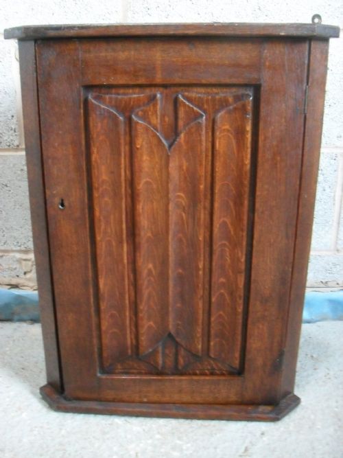 Small Solid Oak Linen Fold Single Door Corner Cupboard with Shelved Interior