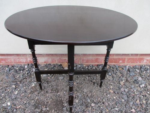 Victorian Mahogany Oval Fold Up Occasional Table with 4 Turned Legs and Cross Stretcher