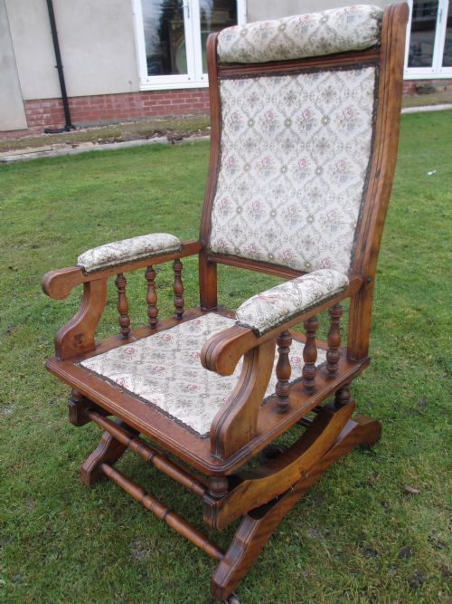 Victorian Walnut and Upholstered American Rocking Armchair
