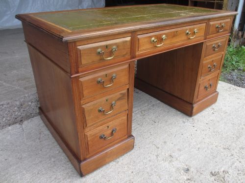 Edwardian Crossbanded Walnut Three Part Twin Pedestal Desk with Tooled Leather, Brass Swan Neck Handles, Drawers with Canted Edges, Reeded Edges on Plinth Base