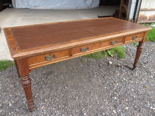 Superb Victorian Oak 6 Ft Library Writing Table Desk with 3 Brass Handled Drawers, Set on Turned and Reeded Tapering Supports with Brass Capped Castors