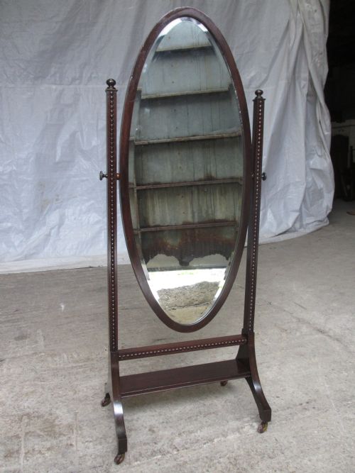 Edwardian Mahogany Oval Bevel Edge Cheval Dressing Mirror with Beaded Moulded Supports Set on Castors