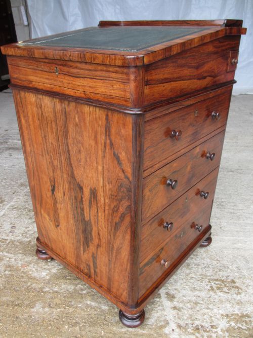 Superb Quality Regency Rosewood  Sliding Top Davenport Desk, Hinged Lid with Tooled Leather, Ink Pen Drawer, 4 Deep Drawers with Turned Handles Set on Bun Feet with Castors