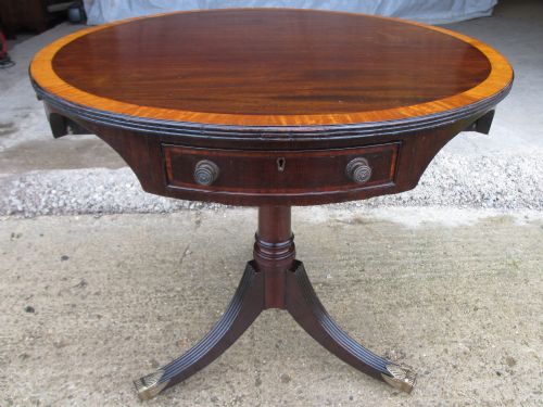 Quality Regency Crossbanded Inlaid Mahogany Revolving Drum Table in Sheraton Style with Four Frieze Drawers, Turned Column, Tripod Reeded Sabre Legs with Brass Capped Castors