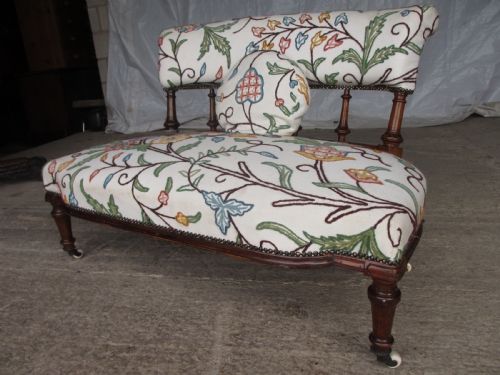 Victorian Walnut Upholstered Window Settee with Turned and Carved Crest Rail Supports, Turned Forelegs, on Castors