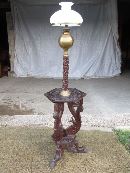 UNUSUAL VICTORIAN ANGLOBURMESE PADOUK TEAK AND BRASS CARVED ADJUSTABLE OIL LAMP - ADDITIONAL PHOTO 1