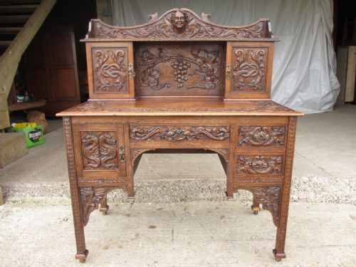 Unusual Victorian Serpentine Carved Oak Writing Desk