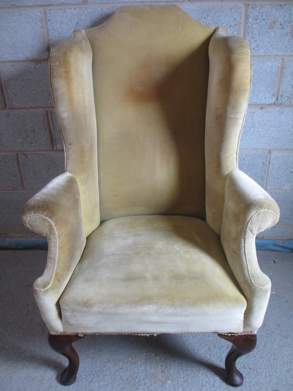 Georgian Mahogany framed upholstered Queen Anne style wing armchair