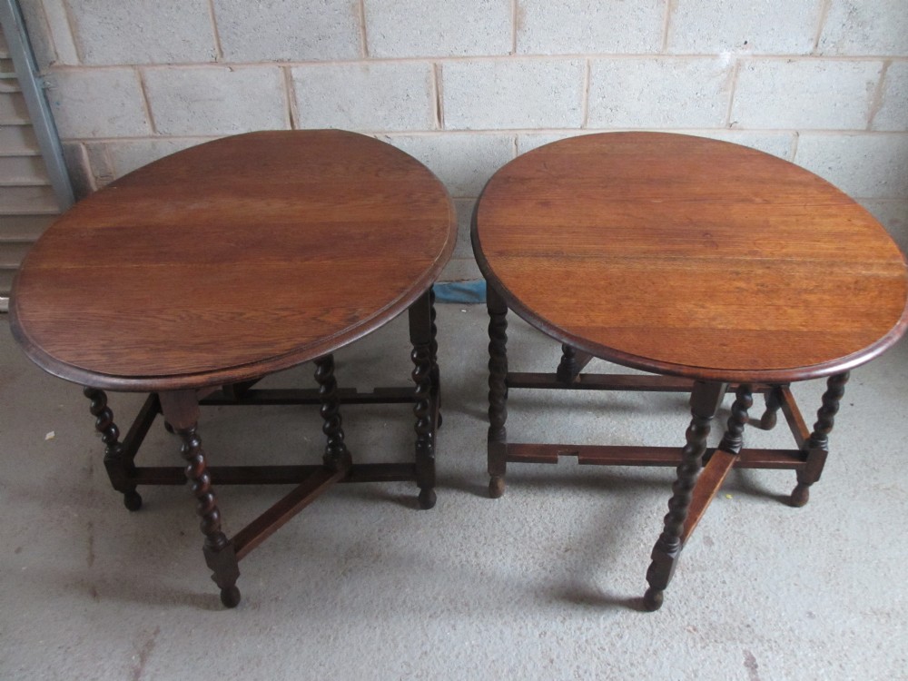 Matched pair of Oak Barley Twist oval gateleg drop leaf dining tables