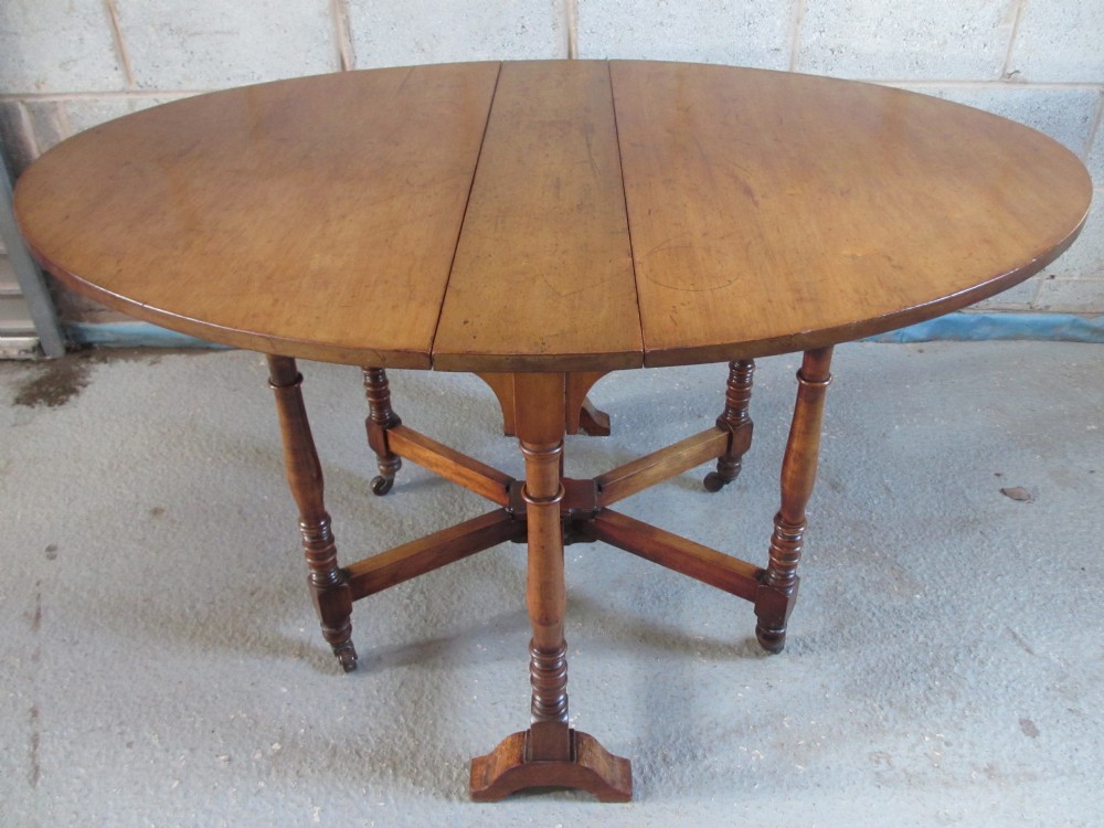 Victorian Walnut oval drop leaf Sutherland dining table 