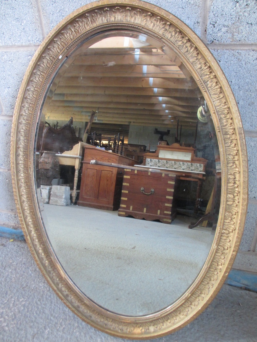19th Century oval gilt framed bevel edged wall mirror 