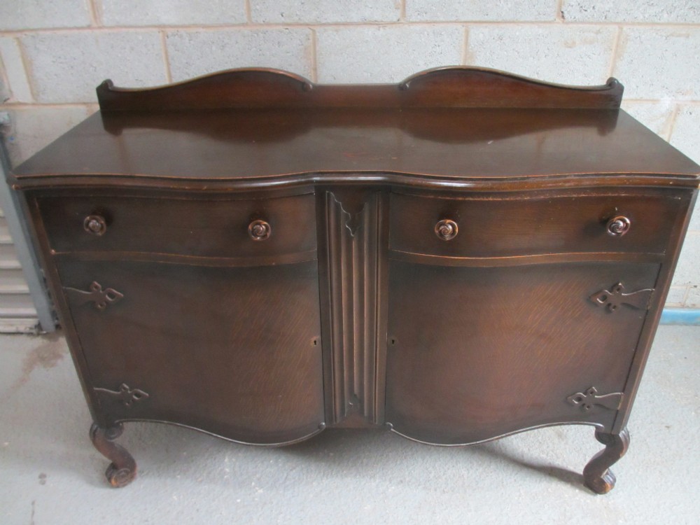 Oak shaped front 2 drawer 2 door sideboard with rose handles