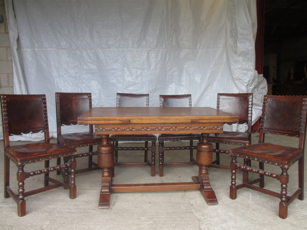 Set of 6 Oak and leather dining chairs and Oak draw leaf dining table 