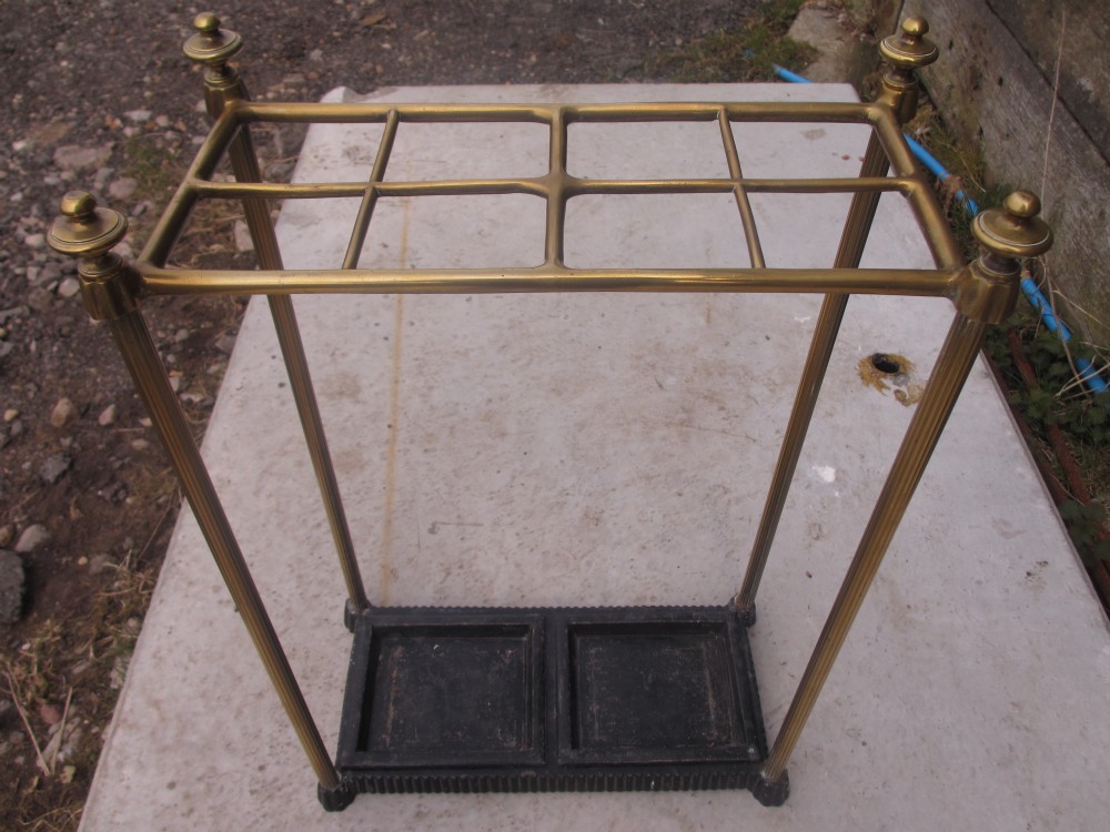 Superb brass 8 section stick stand with cast Iron base and twin drip trays