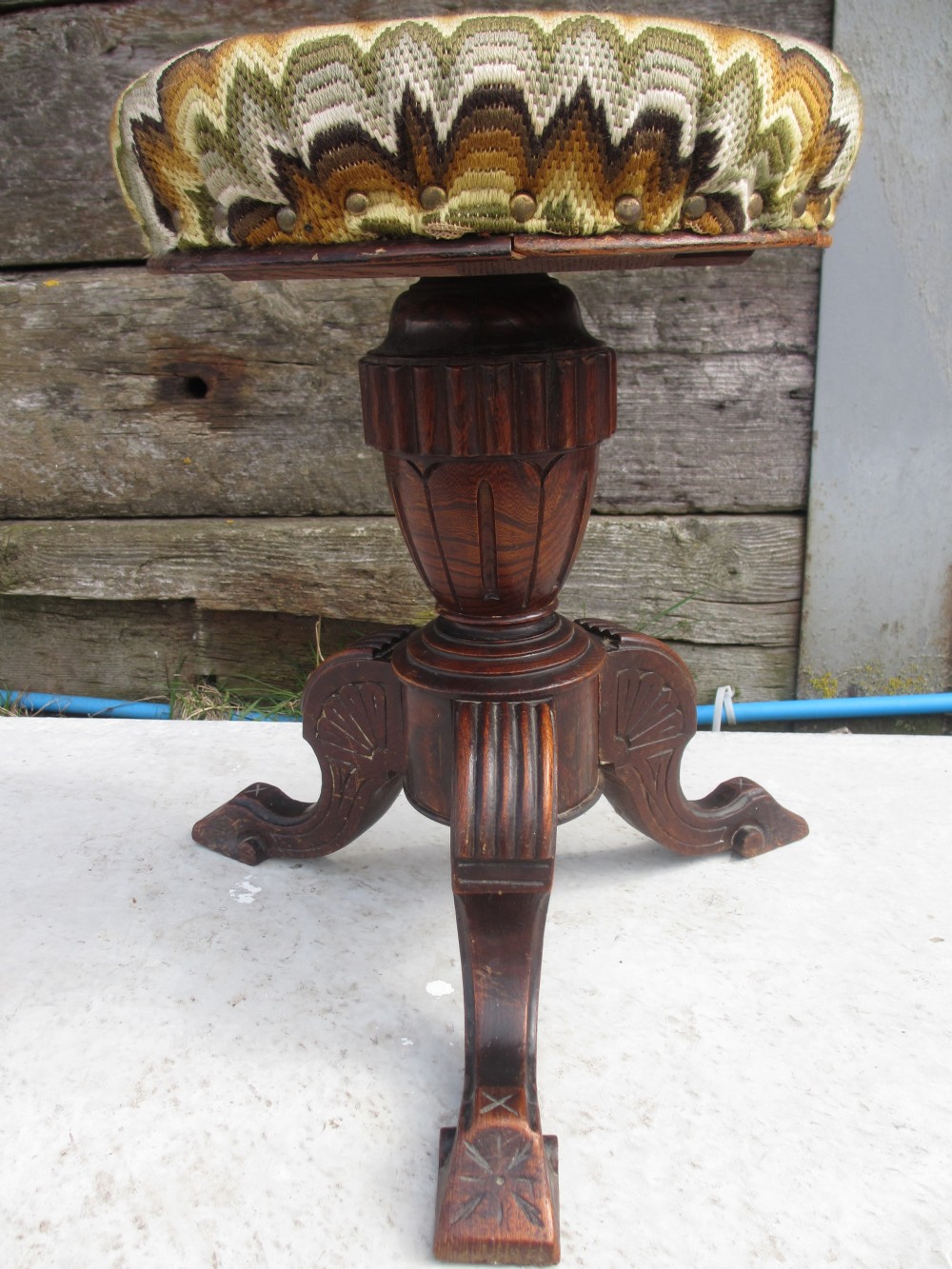 Victorian carved Oak adjustable screw top upholstered piano stool