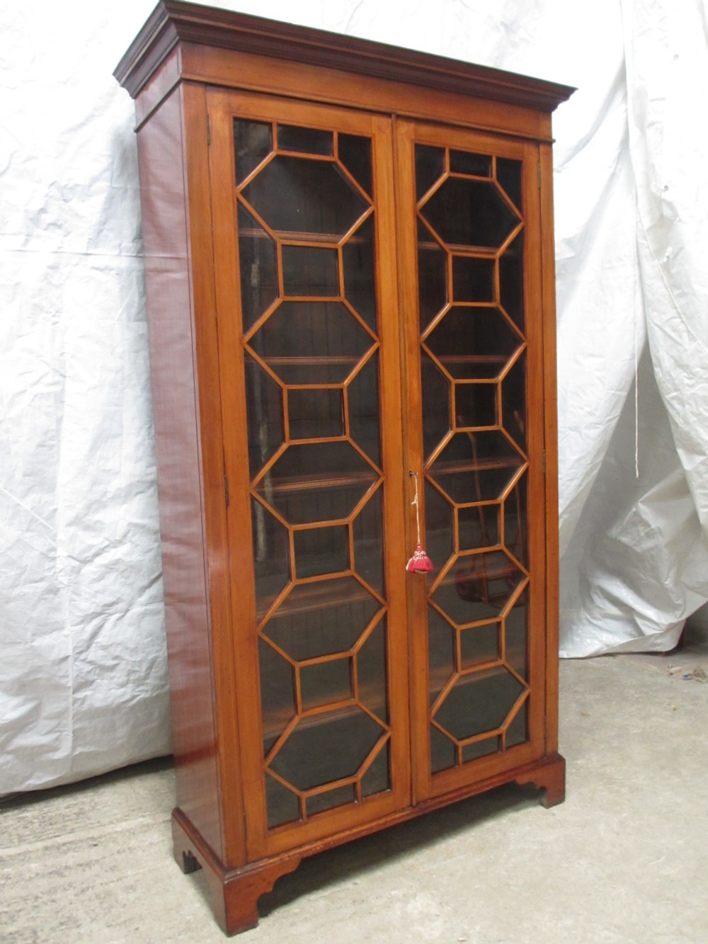 Edwardian boxwood strung Mahogany glazed tall bookcase 