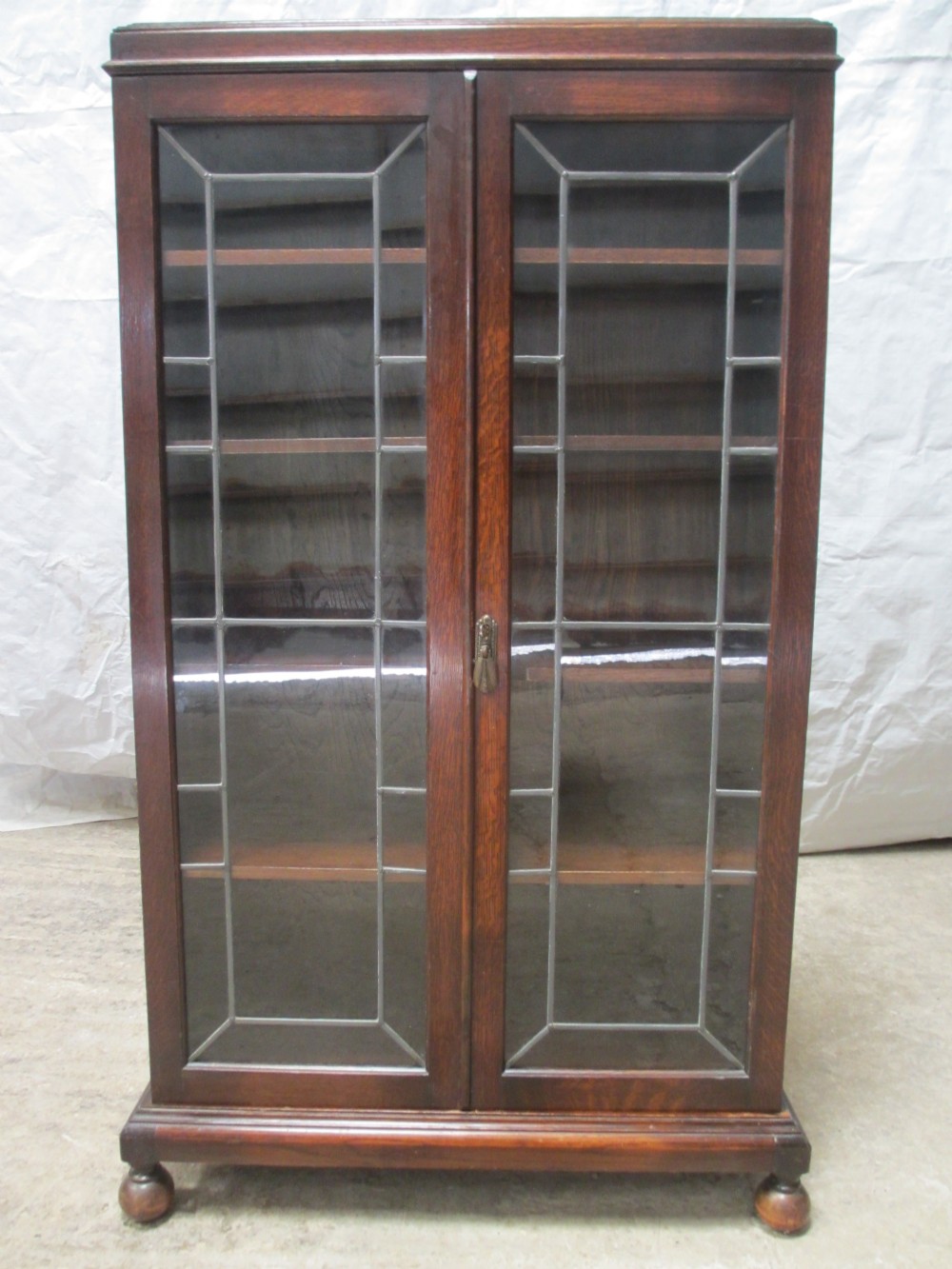 Lead glazed Oak 2 door bookcase with key