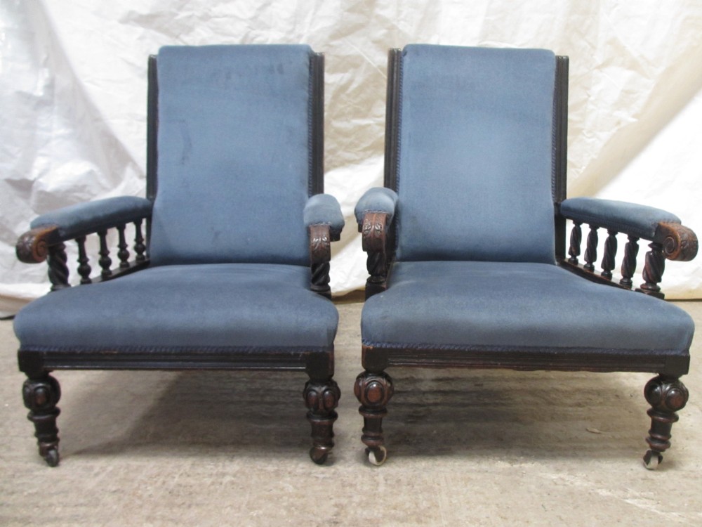 Pair of Victorian ebonised carved Oak upholstered armchairs