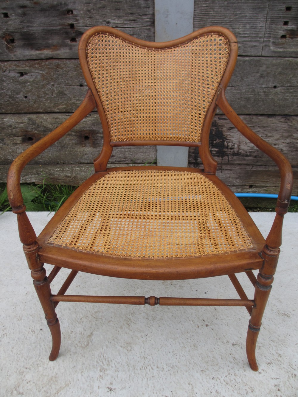 Nicely figured 19th Century Beech-wood Bergere caned armchair 