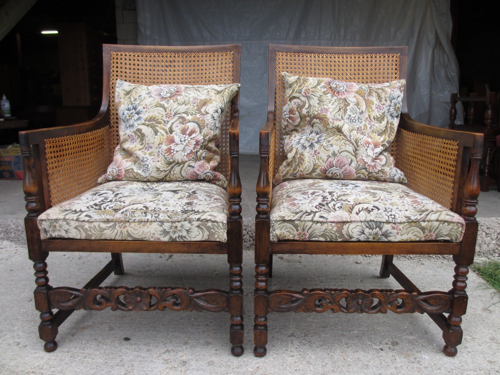 Pair of Victorian oak and beech Bergere caned upholstered armchairs with turned block supports with carved stretcher