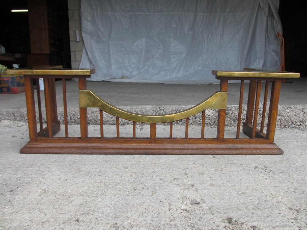 Arts & Crafts oak and brass mounted club fender 