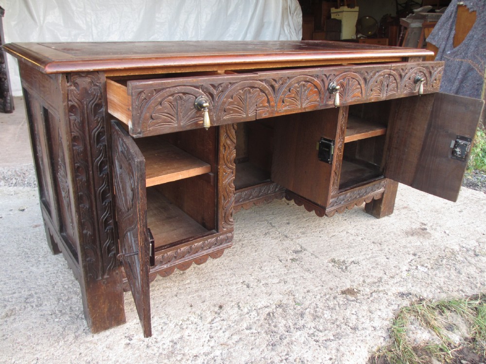 Victorian Heavily Carved Oak Kneehole Desk, 2 Cupboards 3 Drawers  View XVII