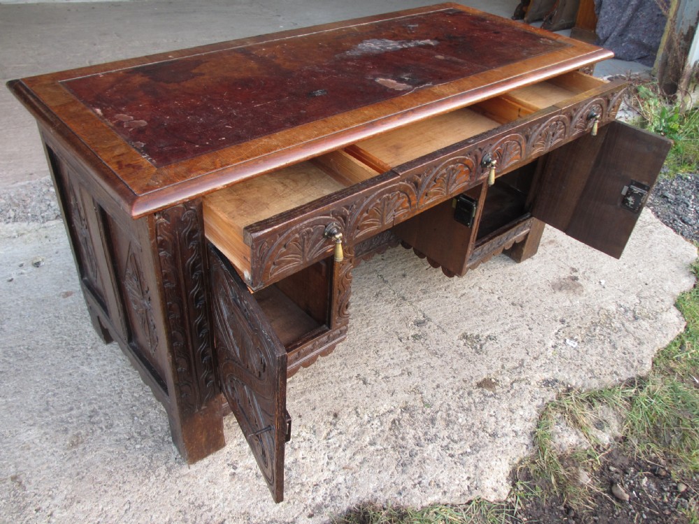 Victorian Heavily Carved Oak Kneehole Desk, 2 Cupboards 3 Drawers  View XVIII