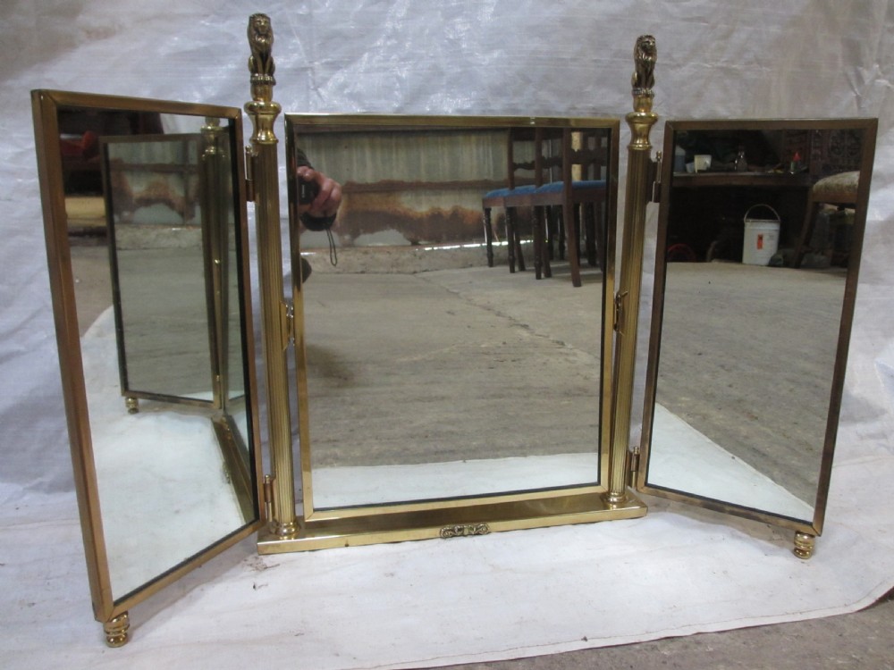 Edwardian brass triptych folding swing dressing table mirror with lion finials