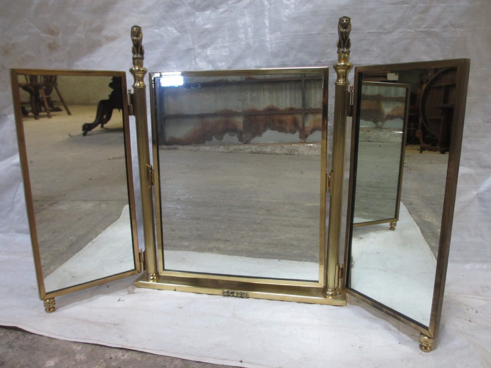 Edwardian brass triptych folding swing dressing table mirror with lion finials View II