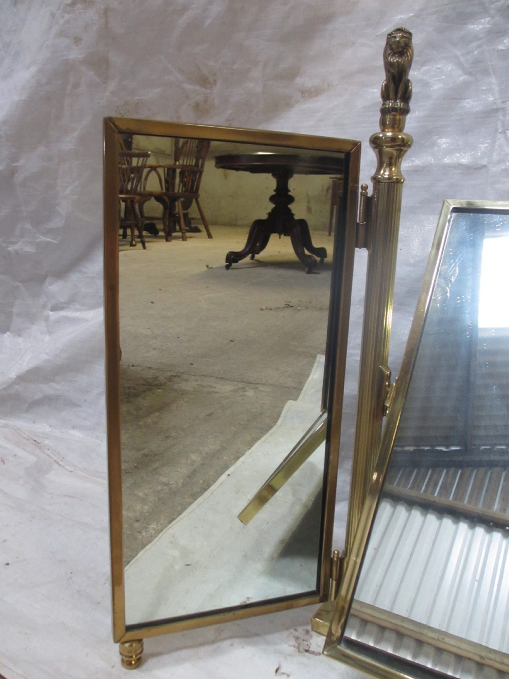 Edwardian brass triptych folding swing dressing table mirror with lion finials View III