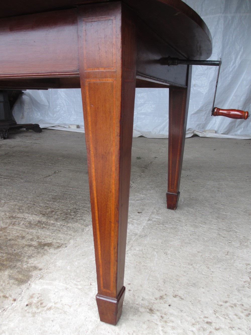 Edwardian D-end mahogany extending dining table, 2 leaves and winding handle, tapered legs and spade feet View V