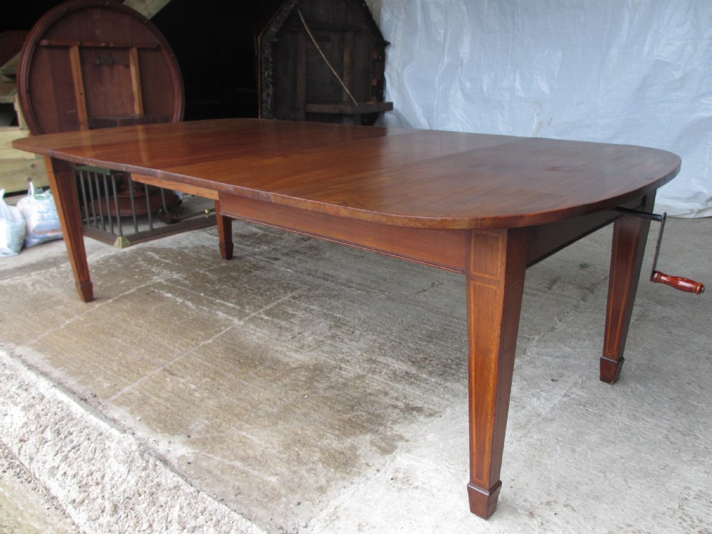 Edwardian D-end mahogany extending dining table, 2 leaves and winding handle, tapered legs and spade feet View VII