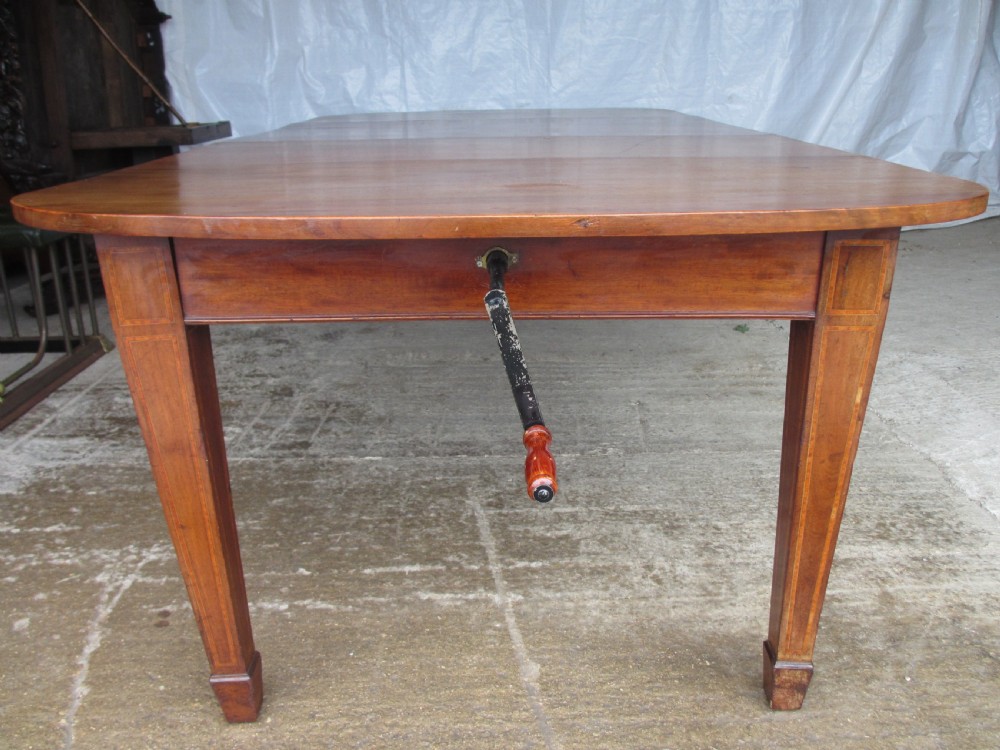 Edwardian D-end mahogany extending dining table, 2 leaves and winding handle, tapered legs and spade feet View IX
