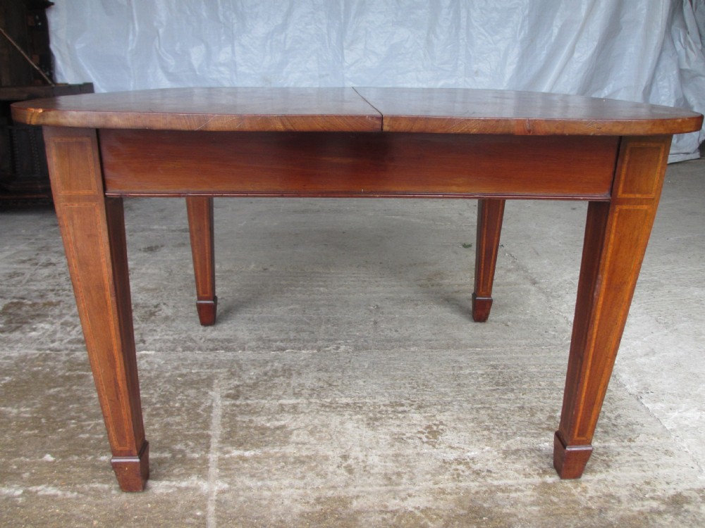 Edwardian D-end mahogany extending dining table, 2 leaves and winding handle, tapered legs and spade feet View XII