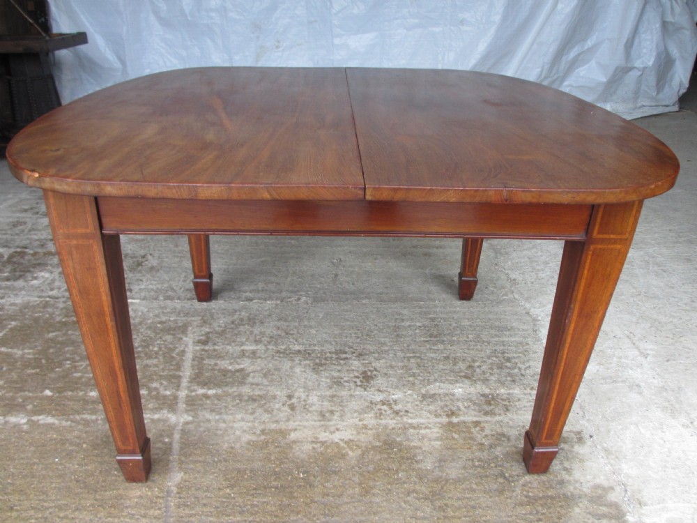 Edwardian D-end mahogany extending dining table, 2 leaves and winding handle, tapered legs and spade feet View XIV