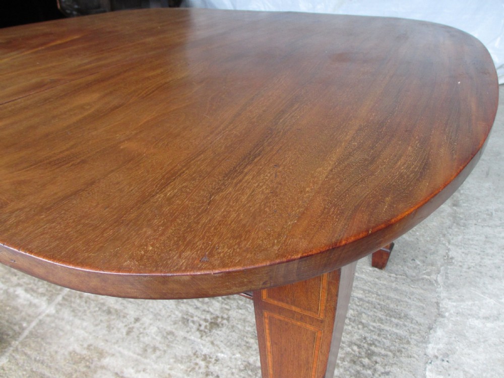 Edwardian D-end mahogany extending dining table, 2 leaves and winding handle, tapered legs and spade feet View XV