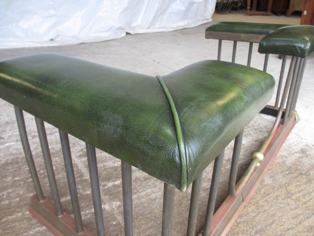 Edwardian brass and upholstered club fire fender with cylindrical uprights  View III