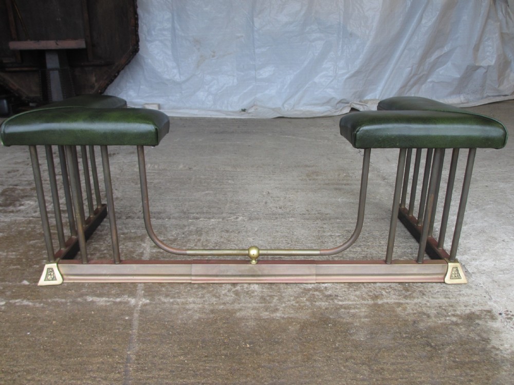Edwardian brass and upholstered club fire fender with cylindrical uprights  View VII