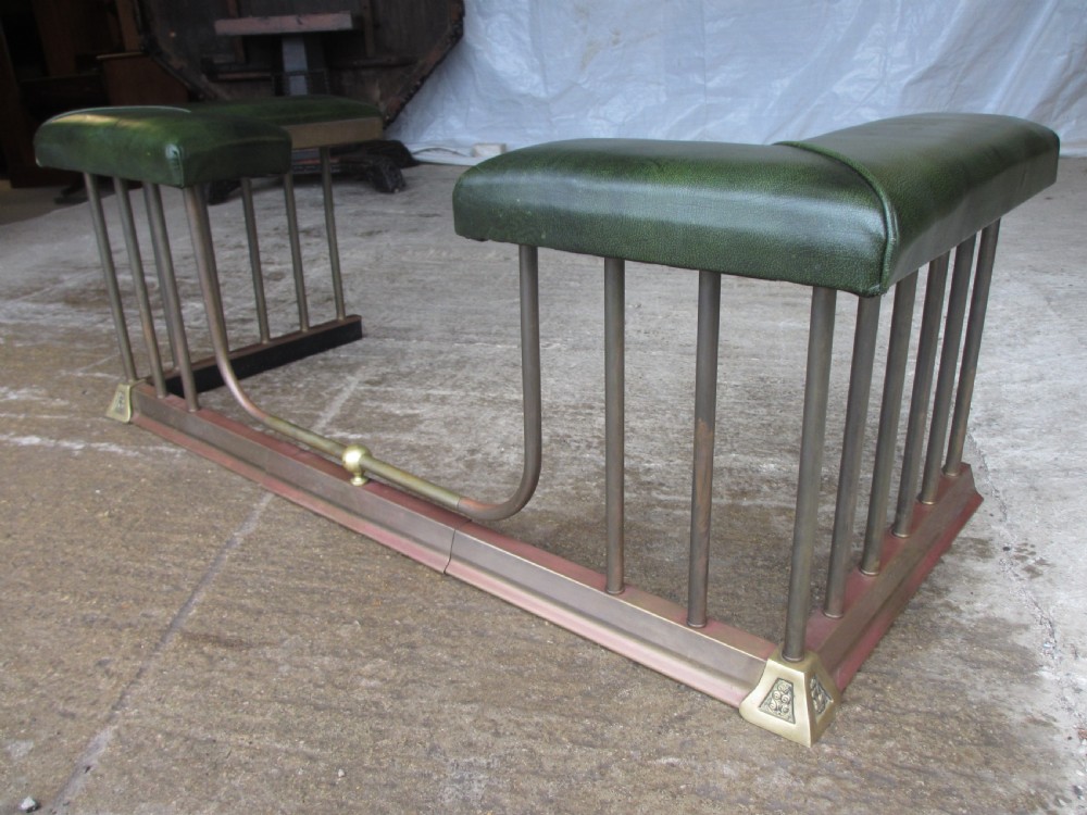 Edwardian brass and upholstered club fire fender with cylindrical uprights  View VIII