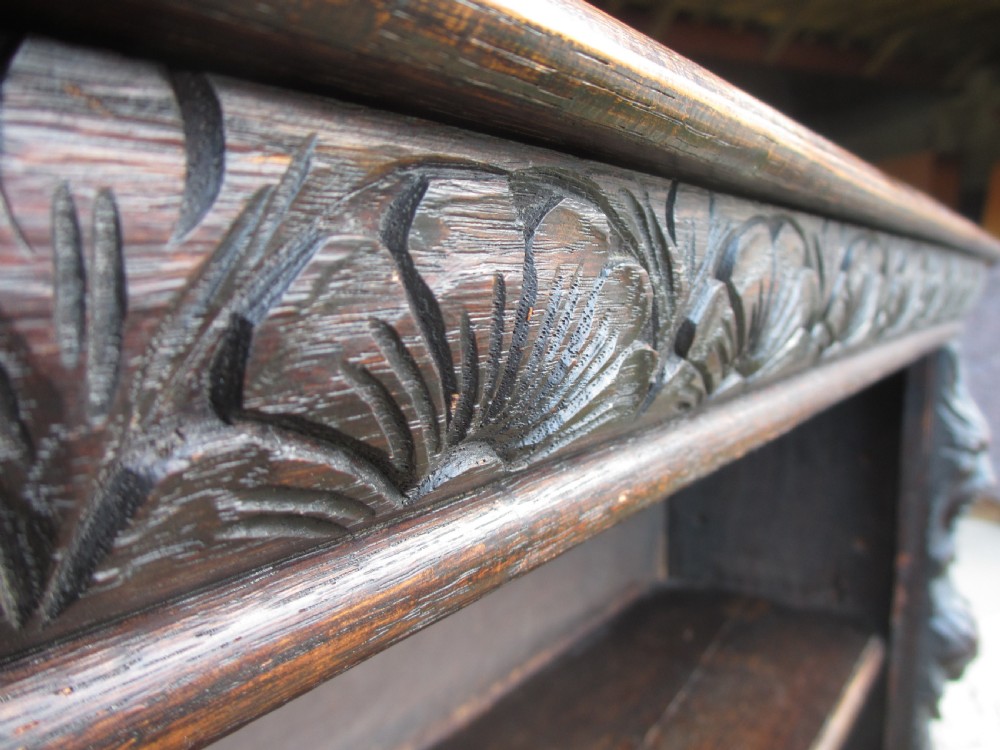 Victorian Oak carved open bookcase with adjustable shelves, lion heads and floral carved columns  View IV