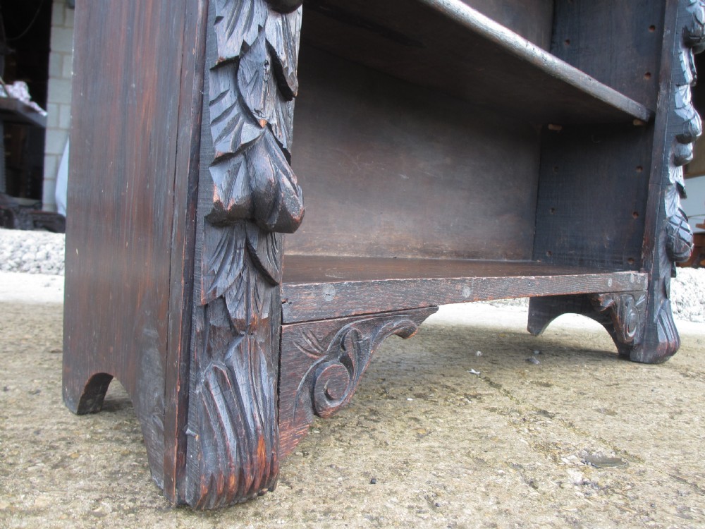Victorian Oak carved open bookcase with adjustable shelves, lion heads and floral carved columns  View IX