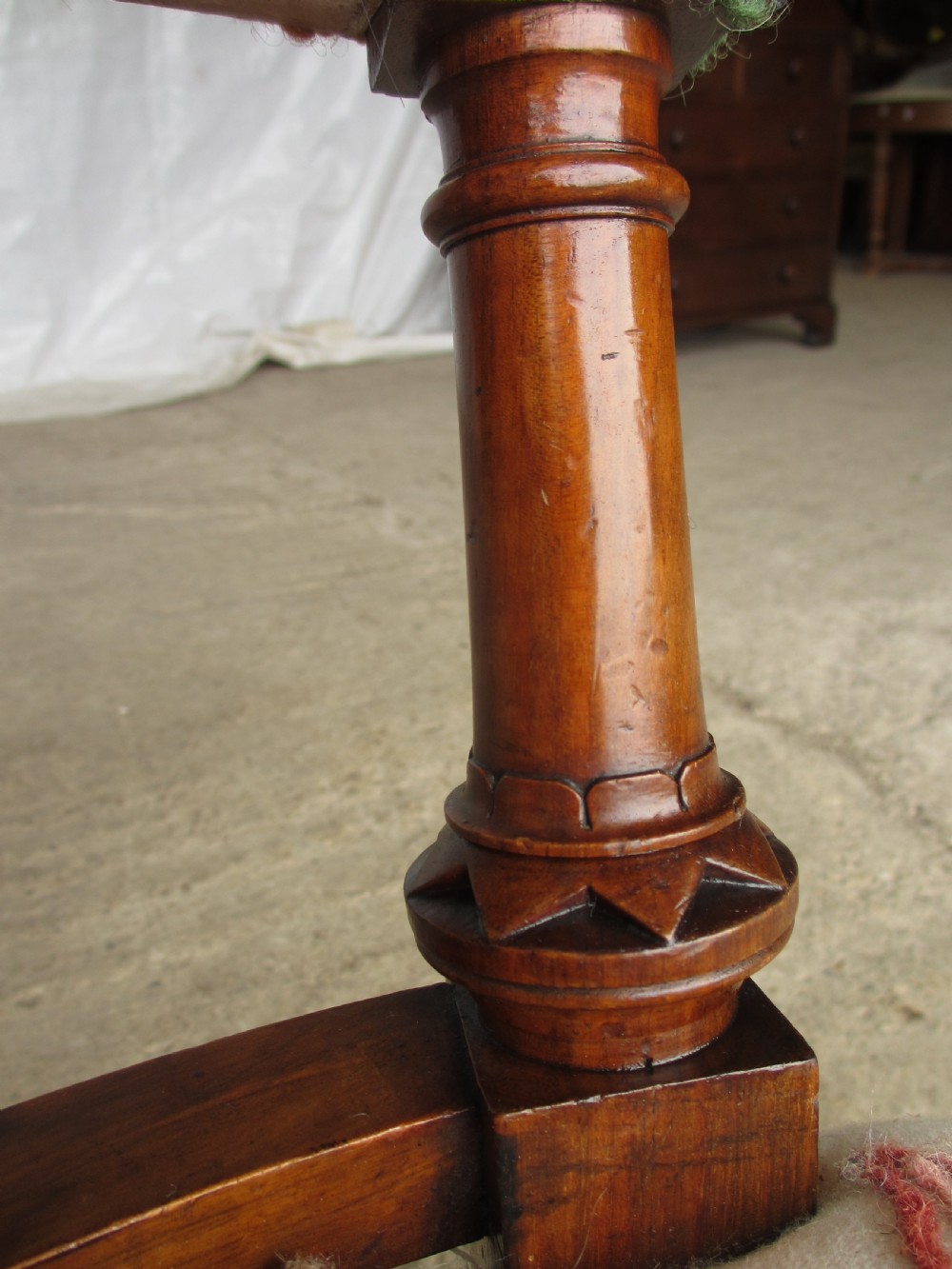 Victorian walnut upholstered window settee with turned and carved crest rail supports, turned forelegs, on castors  View X