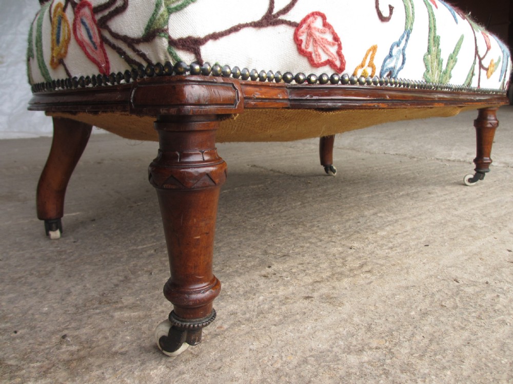 Victorian walnut upholstered window settee with turned and carved crest rail supports, turned forelegs, on castors  View XI