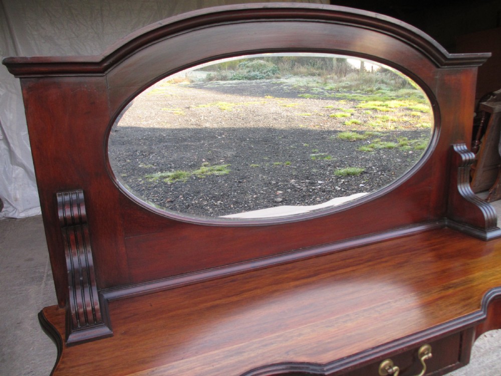 Victorian mahogany mirrored duchess dressing table with scroll supports View II