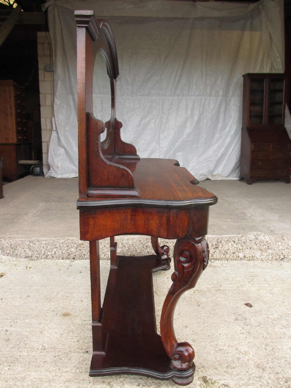 Victorian mahogany mirrored duchess dressing table with scroll supports View XVI