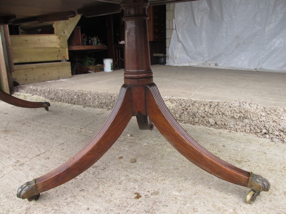 19th century mahogany extending twin tripod d-end dining table with brass paw castors with 2 leaves View VII